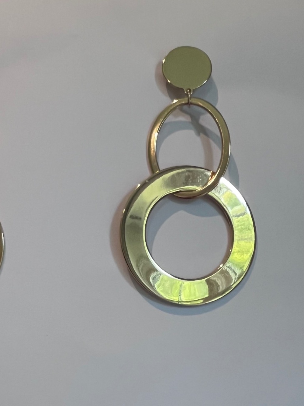 Gold dangling hoops